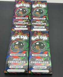 one up mushroom products chocolate bars in colorful packaging